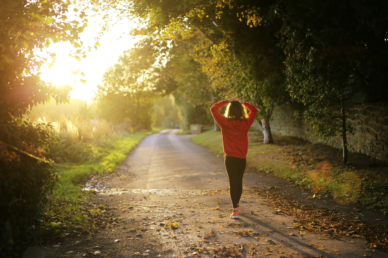 woman walking on pathway during daytime mental health stigma