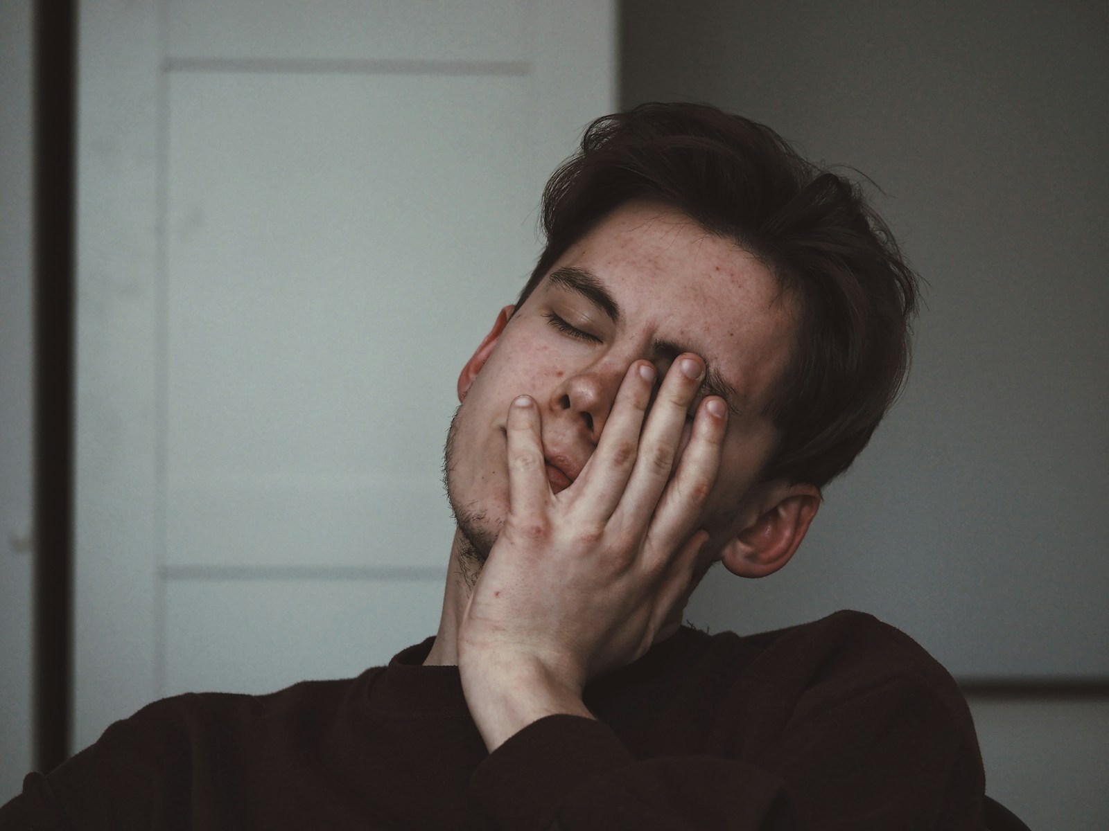 man wearing black crew-neck top compassion fatigue vs burnout