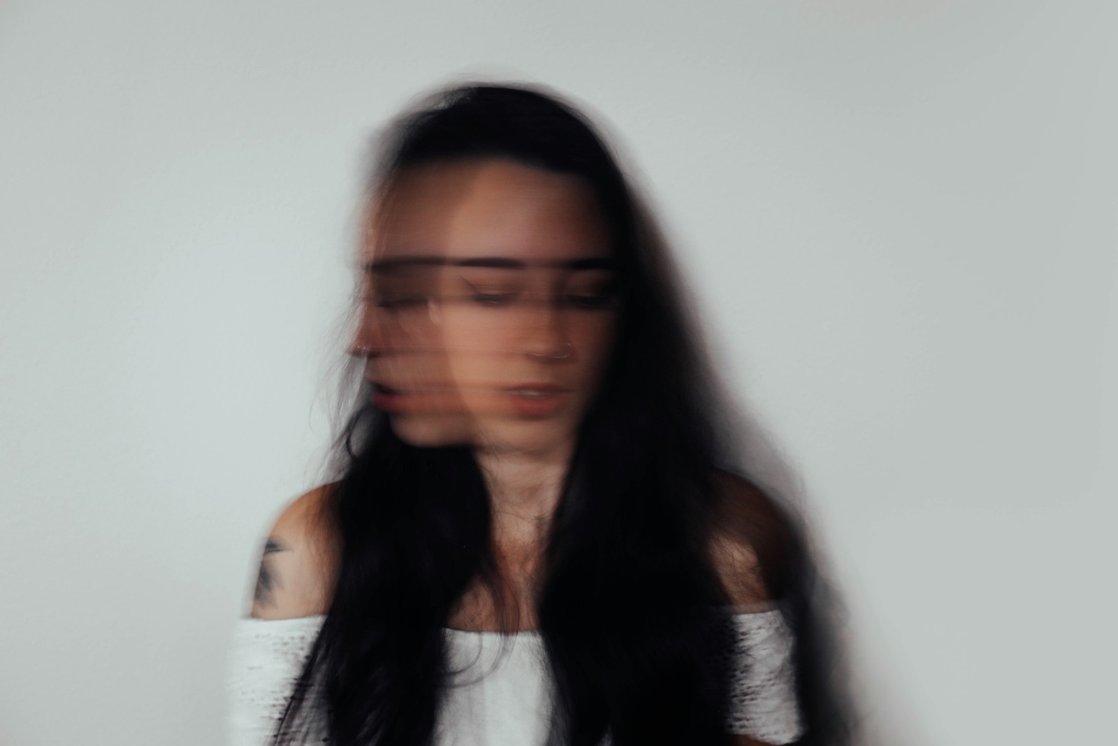 a blurry photo of a woman with glasses does everyone have anxiety