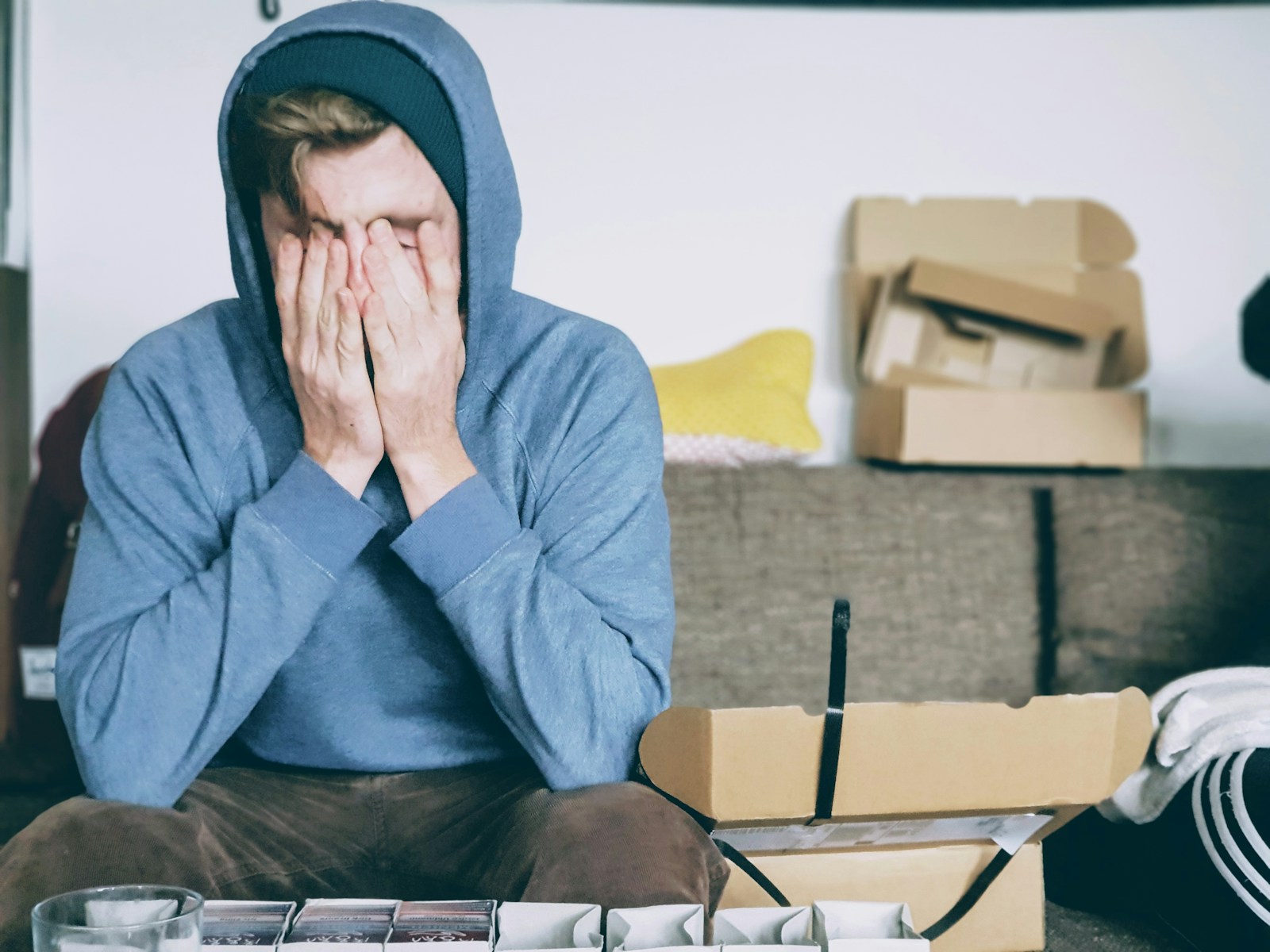 man covering face with both hands while sitting on bench can stress cause a stroke