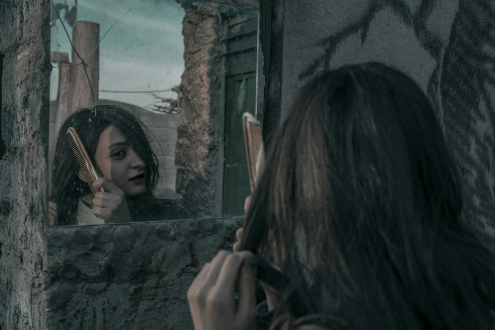 woman combing her hair Narcissistic abuse