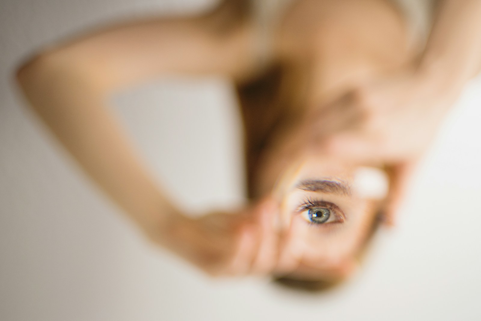 woman holding mirror what is wrong with me