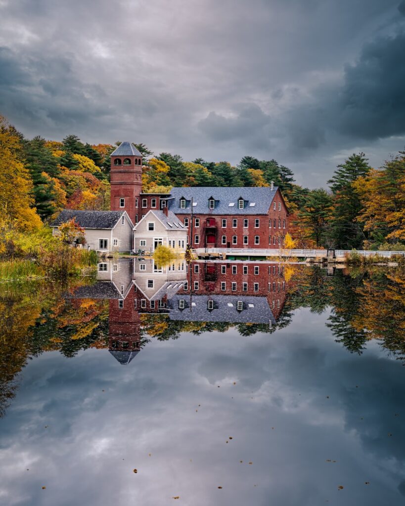 a large building with a bridge over a body of water