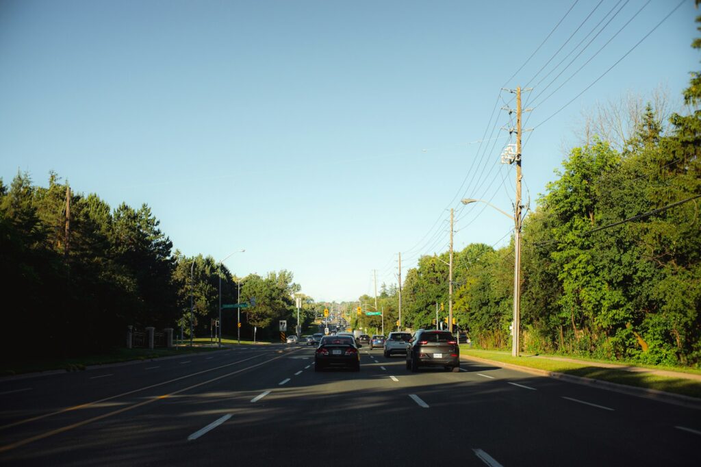 A couple of cars that are sitting in the street