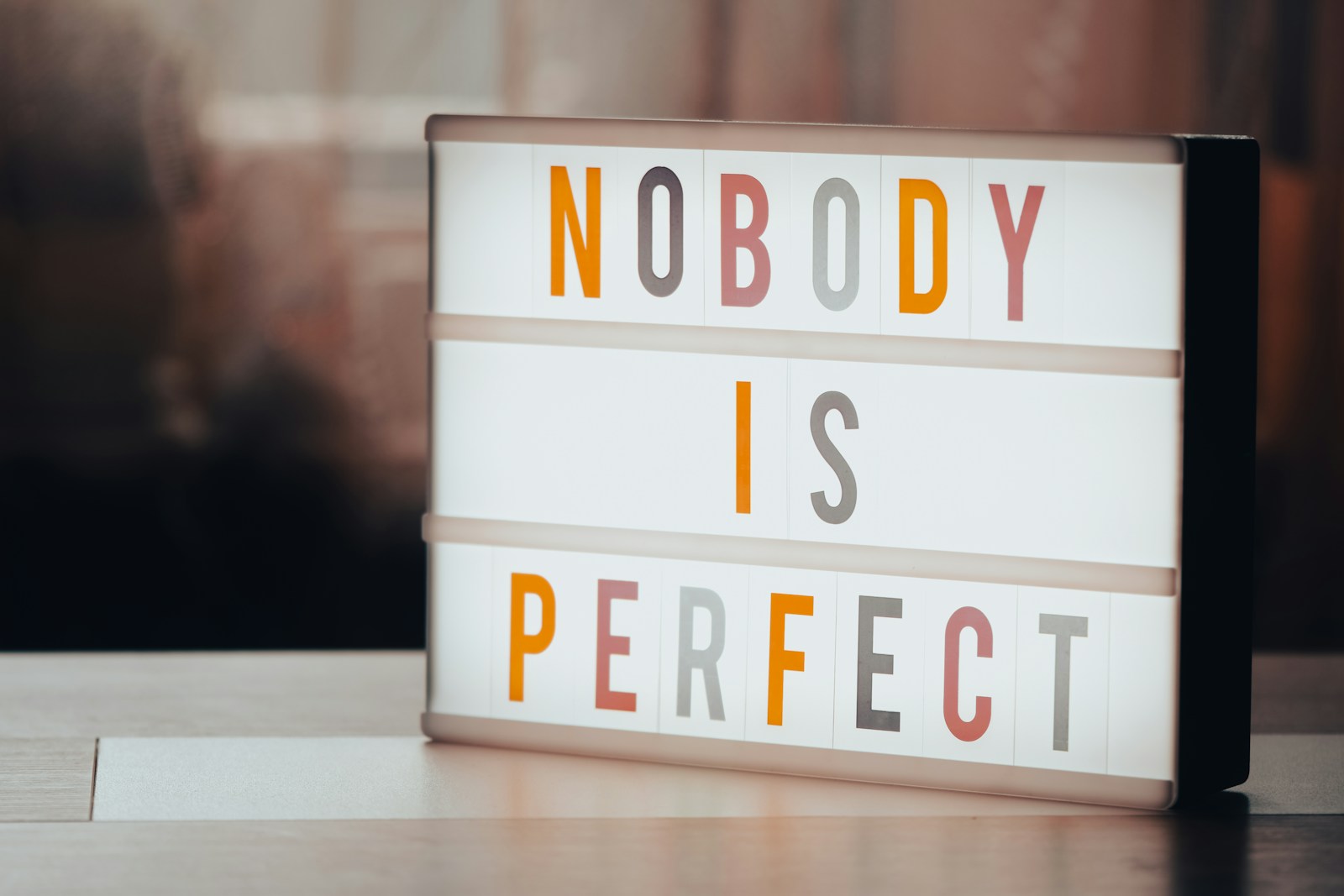 a light box that says nobody is perfect Perfectionism