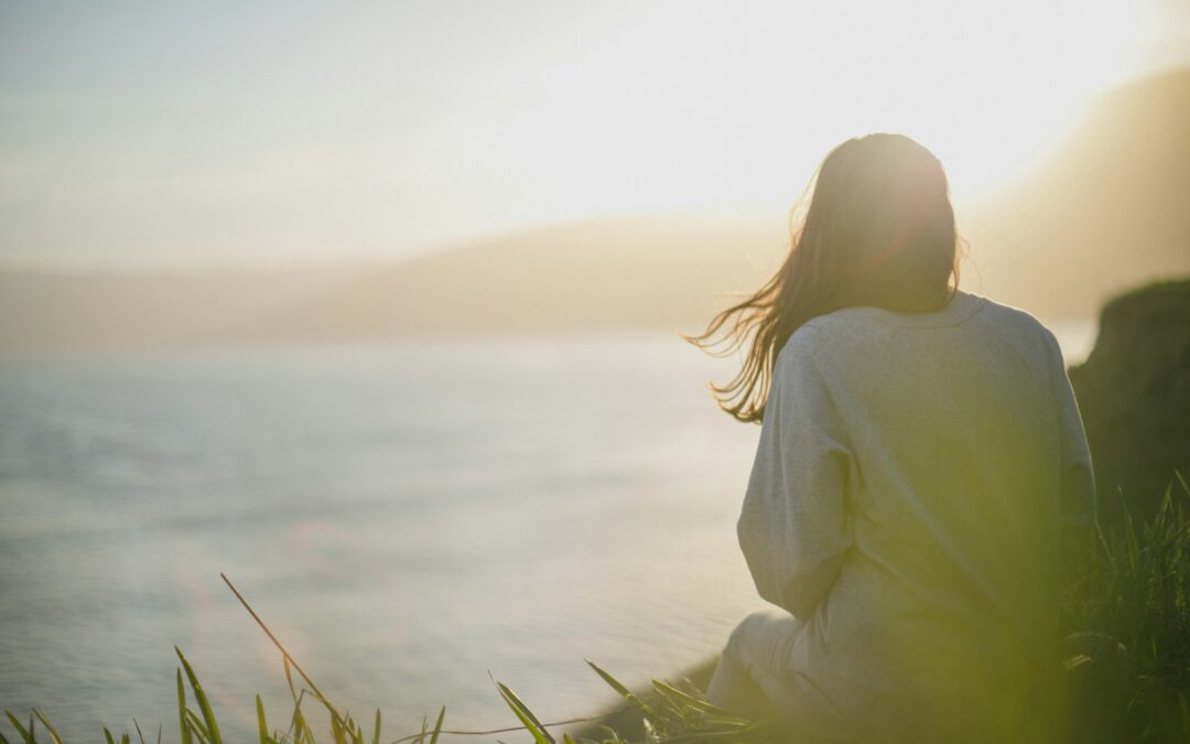woman wearing gray long-sleeved shirt facing the sea Trauma-Focused CBT