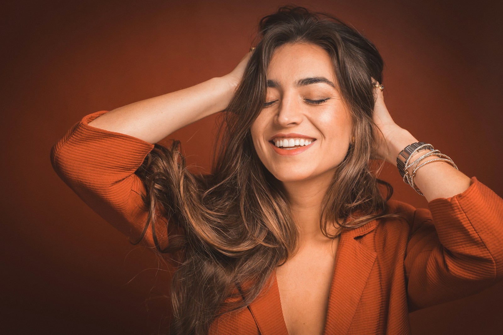 Photo by Pablo Merchán Montes smiling woman in brown top holding hairs Life Coaching
