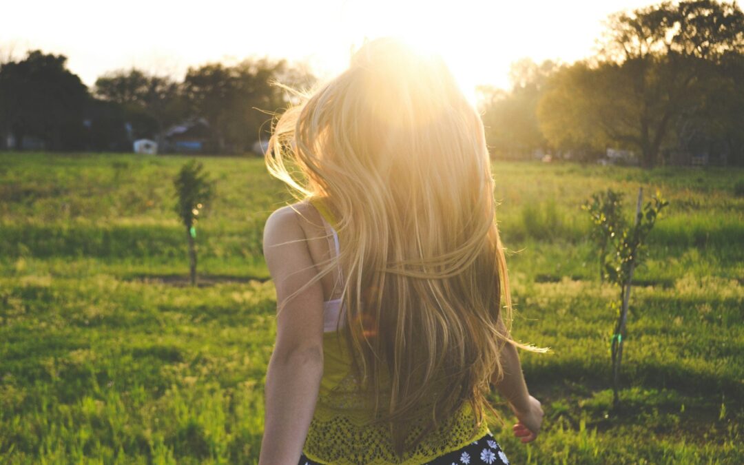 woman walking on lawn with trees Integrative Therapy
