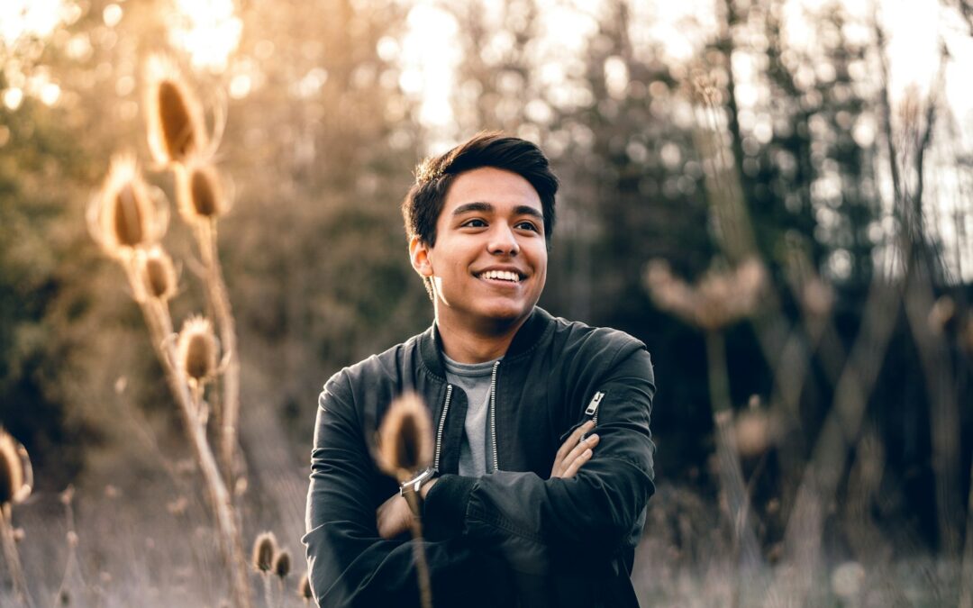 smiling man standing near green trees Client-Centered Therapy