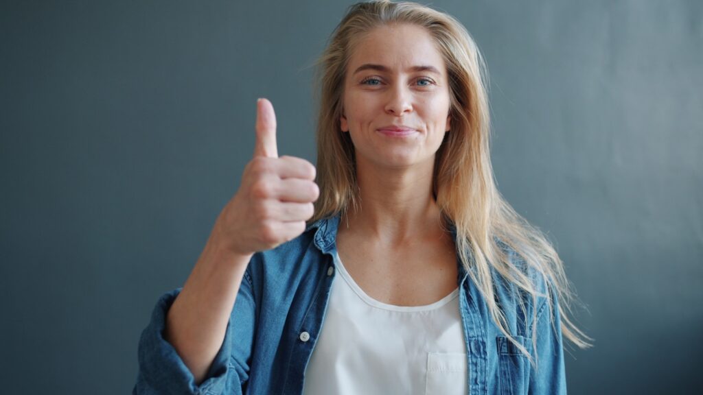 Woman giving a thumbs up gesture