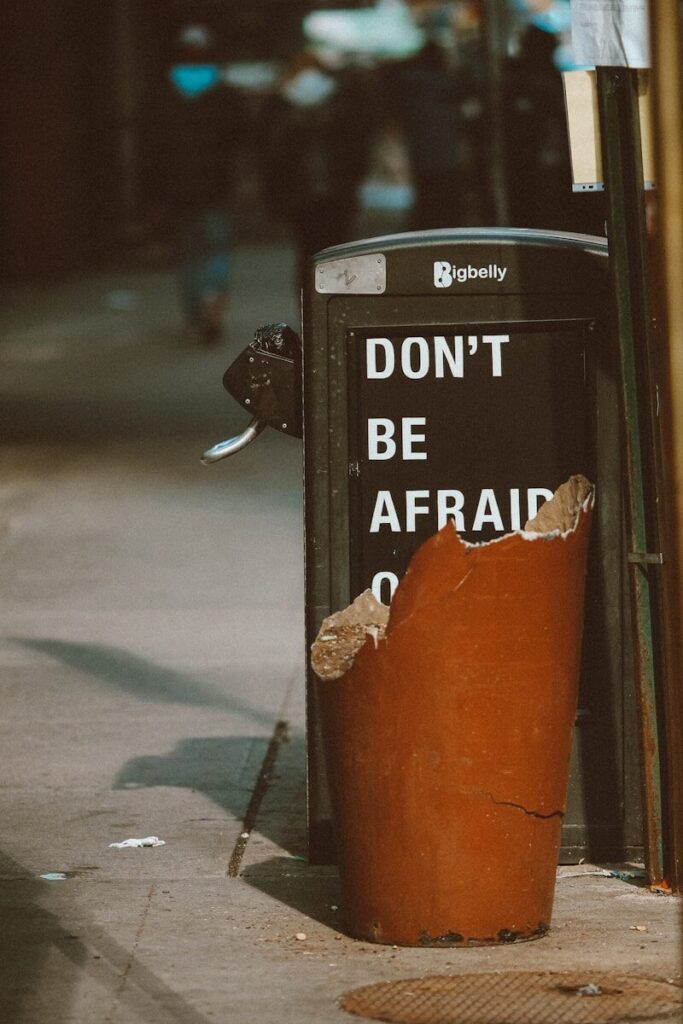 orange and black trash bin