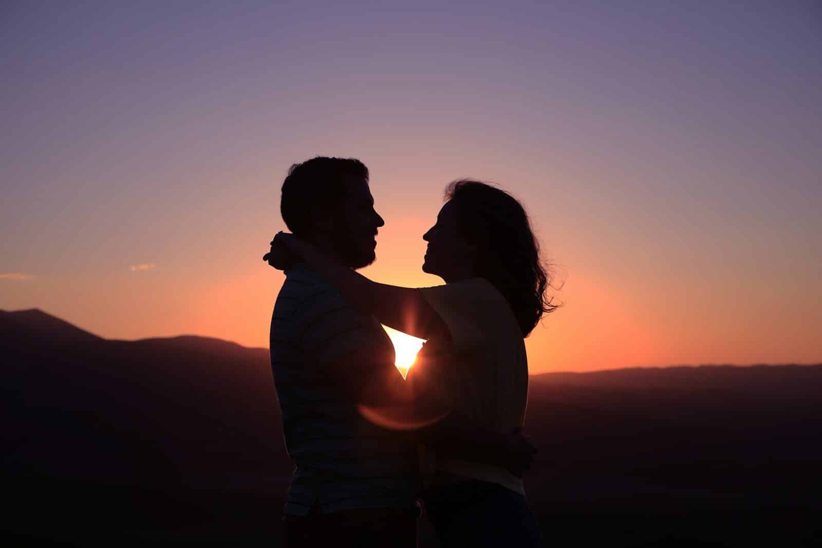 silhouette of hugging couple Avoidant Attachment and Why Connection Can Feel So Complicated