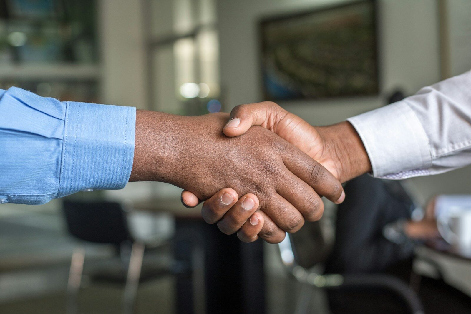 two people shaking hands The Top 15 Most Stressful Jobs and How to Protect Yourself From Burnout