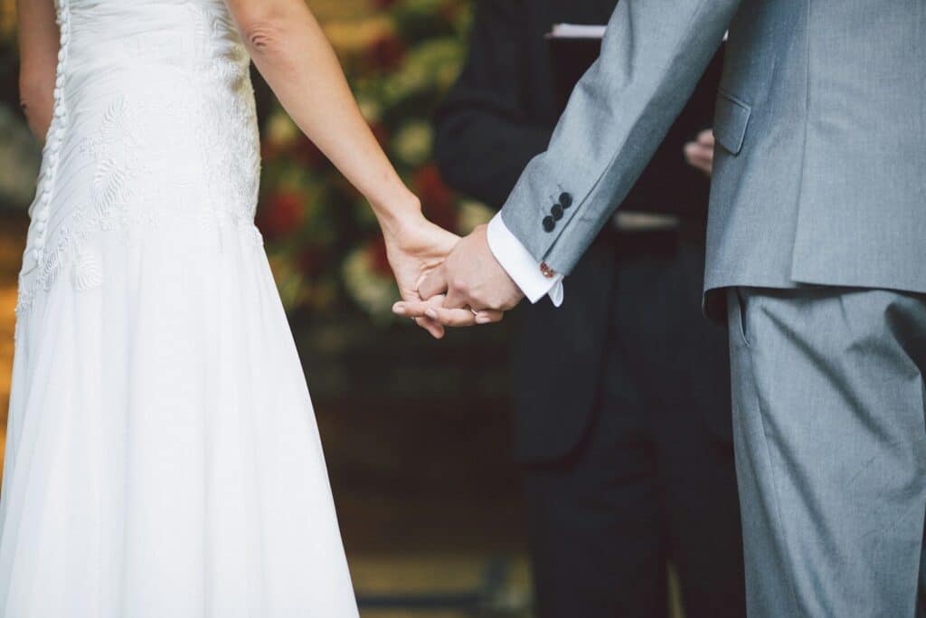 man holding a woman's hands in front of a person