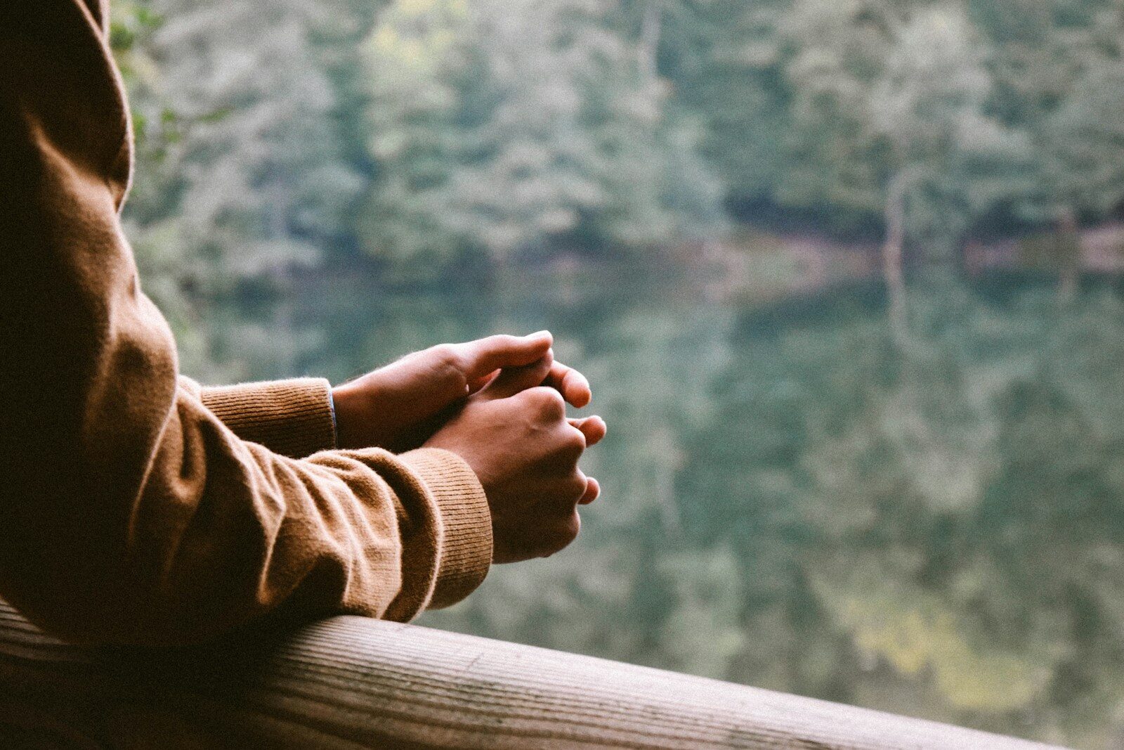 tilt-shift photography of person in brown jacket Is Bipolar Disorder Genetic? Understanding Risk, Family History, and Support